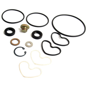 Assorted rubber and metal rings, including circular and heart-shaped pieces, arranged in a pattern on a white background, displaying the precision of the Sparex Seal Kit (Sunstrand Hydratec Pump) – Sparex Part No. S.41597 – akin to the meticulous craftsmanship found in Landini and Massey Ferguson machinery.