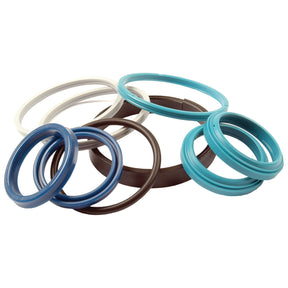 The Seal Kit | Sparex Part No.S.43432 by Sparex includes an assortment of differently colored O-rings, such as blue, white, black, and turquoise rubber rings, arranged in a scattered manner—ideal for use in Massey Ferguson seal kits.