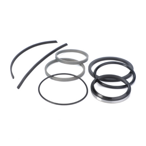 A collection of black rubber and gray metal rings of various sizes and shapes, reminiscent of the AGCO Massey Ferguson 3000 Series tractor Seal Kit Slave Cylinder (Product Code: 3600207M94), arranged on a white background.