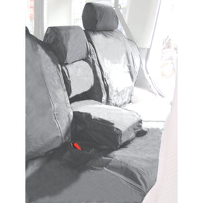 Interior of a vehicle showcasing Sparex black waterproof seat covers, including headrest and armrest covers. The seatbelt buckle is visible, and the seats appear to be designed for a Discovery Series II TD5 1998>2004 | Sparex Part No.S.71783.