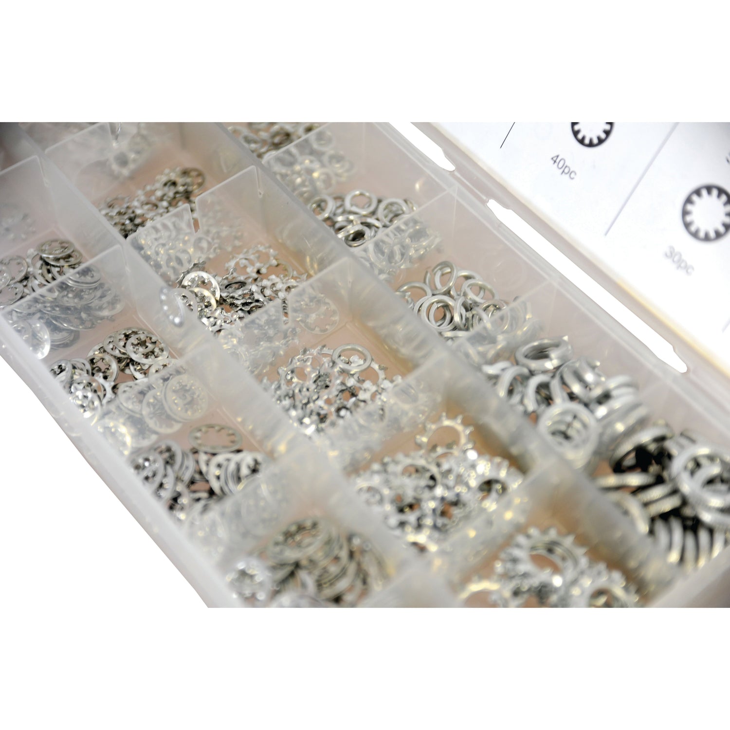 The Sparex Shakeproof & Spring Washer Assortment, Compak S.29889 includes 720 pieces of various sizes of metal washers, such as shakeproof washers and circlips, all sorted into individual compartments within a plastic organizer box.