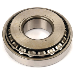 Close-up of a metallic tapered roller bearing with a visible inner and outer ring, marked with text including "Japan," "Sparex," and part number "4T-55175C/55437.