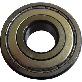 Close-up of a metallic bearing ring with markings, including "Korea" and various serial numbers, engraved on its surface. The object features inner and outer circular tracks, reminiscent of the precision found in high-quality machinery like Sparex's Spigot Bearing - S.146129.