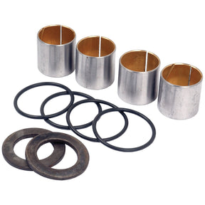 The Spindle Repair Kit (Sparex Part No. S.17617) from Sparex includes four metal cylindrical bushings, four black rubber O-rings, and two black washers, all arranged on a white background. This kit is compatible with David Brown tractors' front axles and is perfect for LH/RH spindles, offering durability and precision for your maintenance needs.