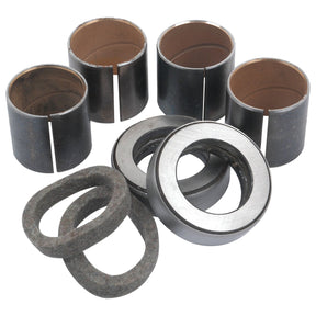 The Spindle Repair Kit, Part No. S.41956 from Sparex, consists of several cylindrical metal bushings, two metal bearings, and three ring-shaped gaskets arranged in a set that is suited for Massey Ferguson tractors.