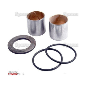 Two metal bushings, two black rubber O-rings, and one metal washer are displayed against a white background. The image has watermarks that read “Sparex” and “Massey Tractor Parts.” This assembly appears to be part of the Sparex Spindle Repair Kit (Part No. S.57863), which could be used for axle spindle repairs on brands like David Brown or Case IH.