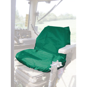 A Sparex Standard Seat Cover - Tractor & Plant - Universal Fit (S.71718) in green, which is waterproof, is placed on the tractor seat inside a vehicle. The surroundings include a window showing an outdoor landscape.