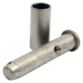 A metal pin with a cylindrical sleeve resting on a white background. The pin is slightly worn with visible marks, reminiscent of components found in the Sparex Steering Pin & Bush Kit (Part No. S.67293).