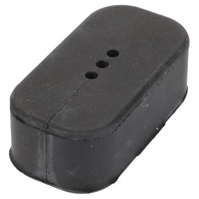 The Fendt - Stop - F733300020050, by AGCO, is a small, rectangular black rubber block featuring two flat sides, rounded edges, and three evenly spaced holes on the top surface. This versatile component is perfectly suited for Fendt Models such as the 714 Vario SCR or 716 Vario SCR.