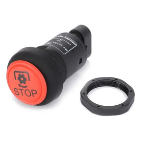 A Massey Ferguson - Switch PTO - 4284626M2 by AGCO, partially disassembled, with a red stop button switch and a black plastic housing, is lying next to a detached black plastic ring. This product is suitable for Massey Ferguson 5400 Series tractors.