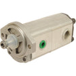 A close-up of the Sparex Tandem Hydraulic Pump - S.44124 with a cylindrical shape, featuring a central drive shaft, green O-ring, and multiple mounting points. This silver tandem pump is designed for maximum pump speed and efficiency.