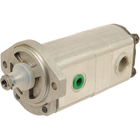 A close-up of the Sparex Tandem Hydraulic Pump - S.44124 with a cylindrical shape, featuring a central drive shaft, green O-ring, and multiple mounting points. This silver tandem pump is designed for maximum pump speed and efficiency.