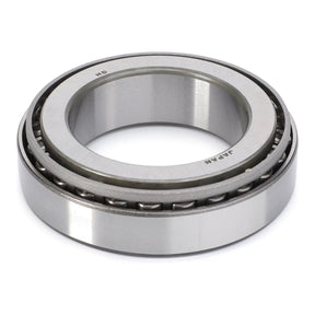 The AGCO Massey Ferguson - Tapered Roller Bearing, Differential - 3009853X1 is a metal roller bearing with tapered roller elements enclosed within an outer ring, typically used in machinery like Massey Ferguson tractors for reducing friction between moving parts.