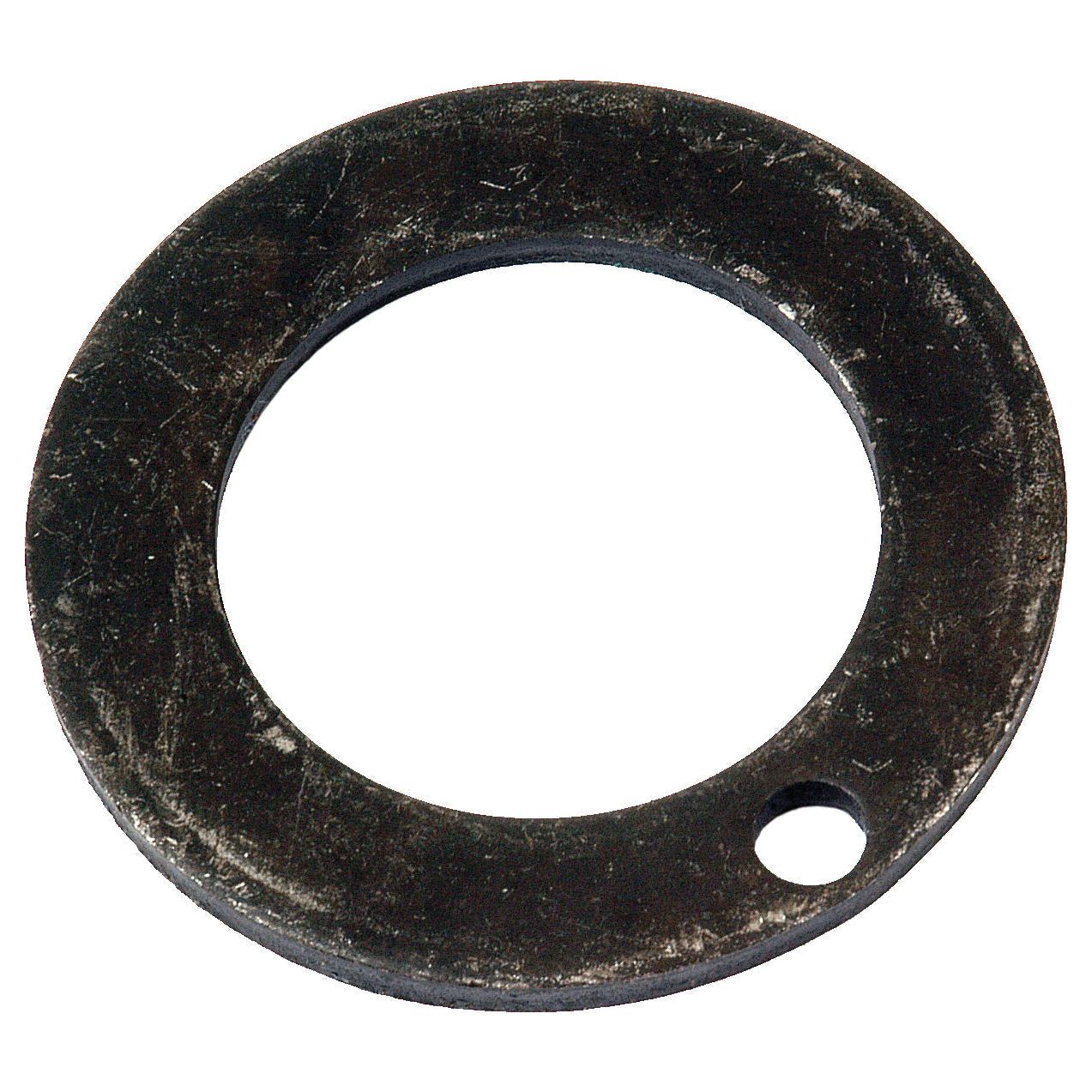 A black metal thrust washer, with a large central hole and a small secondary hole near the edge, typically used in the front axle of Allis Chalmers machinery, is available as the Thrust Washer under Sparex Part No. S.59023 by Sparex.