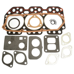 A collection of various engine gaskets, featuring the Top Gasket Set - 3 Cyl. by Sparex (Part No. S.4972148) for a John Deere, arranged on a white background with head gaskets, exhaust gaskets, and other assorted shapes and sizes.