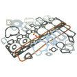 A variety of engine gaskets and seals are arranged on a white background. The set includes different shapes and sizes for various engine components, perfect for a 6 Cylinder Massey Ferguson. This Top Gasket Set - 6 Cyl., known as Sparex Part No.S.40598, ensures optimal performance for your machinery.