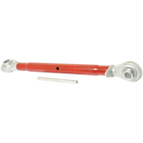 A Sparex Top Link Heavy Duty (Cat.2/2) Ball and Ball, 1 1/4'' with a minimum length of 635mm in red, featuring silver mounting ends and accompanied by a small metal rod, ideal for use as a tractor implement.