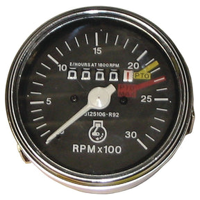 Close-up of a round tachometer, likely an S.61427 model from Sparex, with a needle pointing at 15. The display reads "RPM x 100," and there's a numeric counter showing "00000.