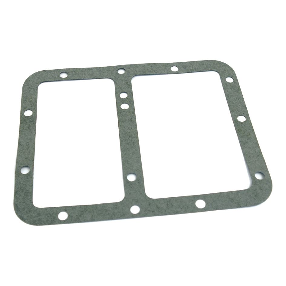 The Transmision Cover Gasket (Sparex Part No.S.66154) is a rectangular top cover gasket with multiple holes along the edges designed for sealing purposes, compatible with Ford / New Holland machinery.