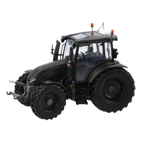 A meticulously replicated scale 1:32 collectible model of the Valtra G135 tractor by AGCO, featuring modern aesthetics in matt black and ultra green, large tires, and an enclosed cab.