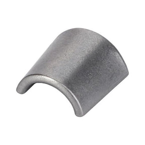 A small, curved, metallic piece with a semi-cylindrical shape and smooth surface, similar to a cylindrical segment or bearing shell, commonly found in Massey Ferguson tractor parts for the 300 Series or 100 Series is referred to as the Massey Ferguson Valve Cotter (731155M1) by AGCO.