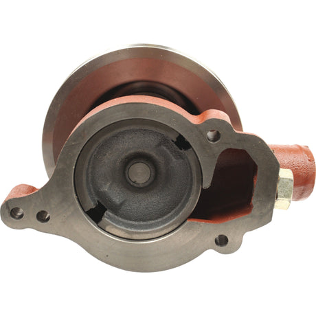 Close-up view of a mechanical component, likely part of a Valmet & Valtra engine, featuring a circular metal housing with a void and openings for mounting, including the Sparex Water Pump Assembly (Supplied with Pulley), Part No. S.67402.