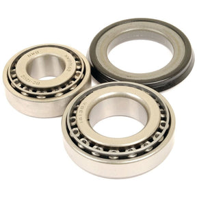 Three metal bearings of different sizes, resembling components from the Sparex Wheel Bearing Kit - S.57280, are arranged on a white surface.