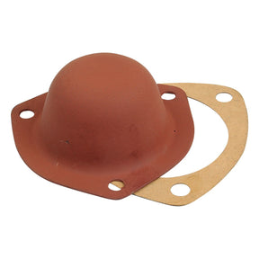 Introducing the Hub Cap (Sparex Part No. S.59544) from Sparex – a reddish-brown rubber diaphragm featuring an attached cardboard gasket, both with circular cutouts for easy mounting, ideal for vintage International Harvester vehicles.