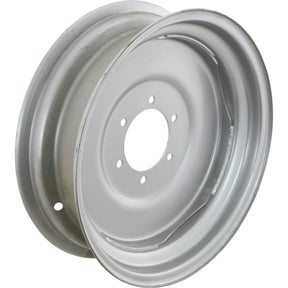 A Sparex Wheel Rim, S.40288, sized at 5.5 x 18 inches, features a silver metallic design with a circular central opening and multiple smaller holes around it, ensuring a precise bore diameter for optimal fitment.