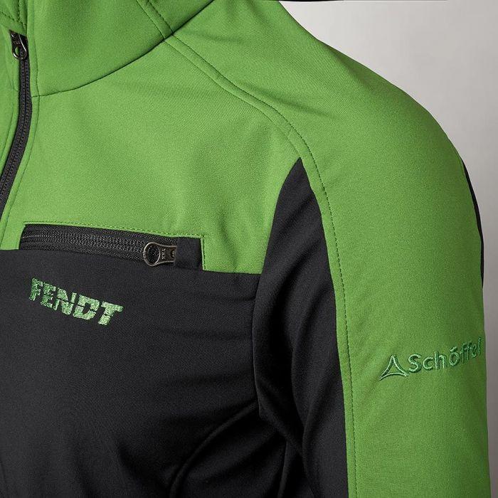 Close-up of a black and Fendt green women's fitting jacket with "FENDT" and "Schöffel" embroidered on it, featuring a zippered chest pocket, known for its high durability. This is the AGCO - Fendt Women's Softshell Jacket (Product Code: X99102004C).
