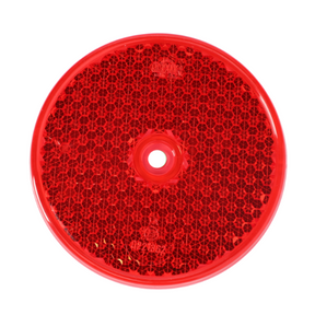 The AGCO Fendt - Rear Reflector - X830190060000 is a red, round reflector with a central hole that is commonly used on bicycles for visibility and safety and also finds its place in tractor safety equipment.