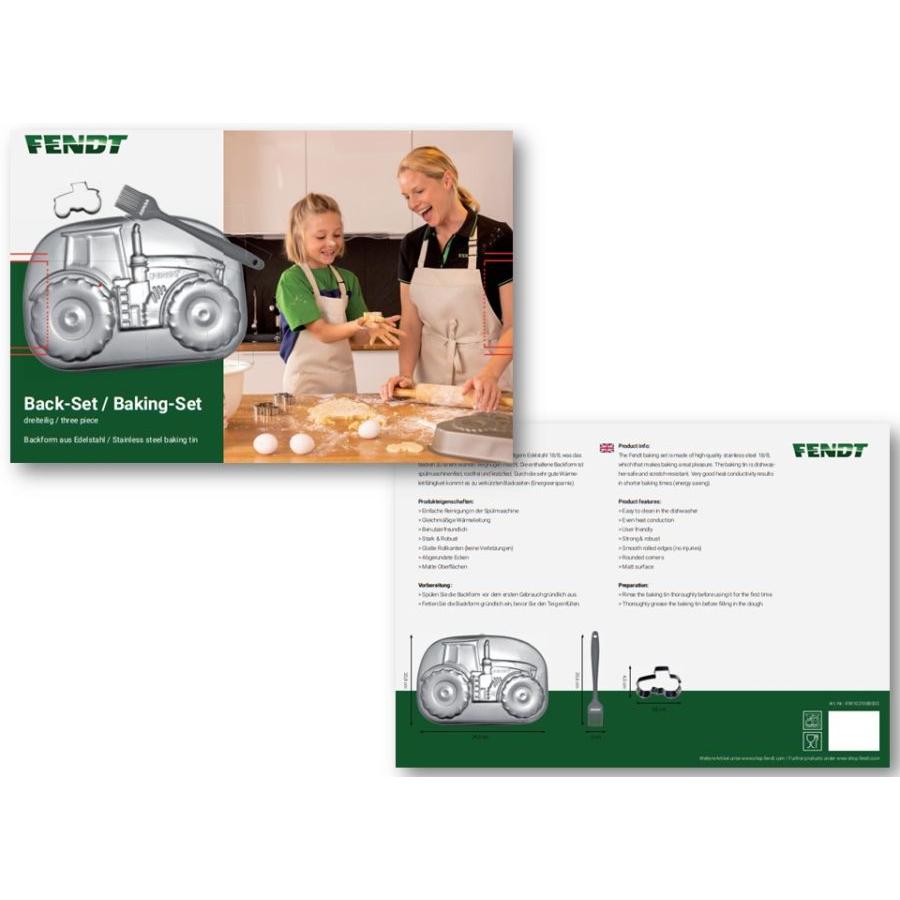 Image of the AGCO Fendt - Fendt 1050 Vario Baking Set (X991021088000) packaging, featuring a picture of an adult and child baking. The set includes a dishwasher-safe tractor-shaped stainless steel cookie cutter, whisk, and spatula. The back shows product details.