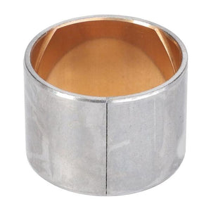 A silver metallic bushing with a split along its side and a bronze interior, designed as a replacement part for various Massey Ferguson models. This product, VA125390, is manufactured by AGCO.