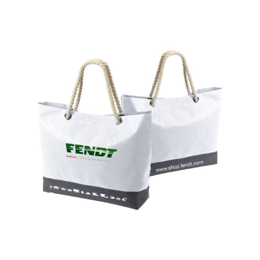 Two white tote bags with rope handles exude maritime flair. One, the Fendt Shopper by AGCO (Product: X991021113000), features the iconic logo and a catchy slogan; the other large bag displays "www.shop.fendt.com" at the bottom.