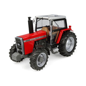 A red Massey Ferguson - MF 2625 | 1:32 - X993042206350 by AGCO, featuring large black tires, a silver front grille, and a glass-enclosed panoramic cab.