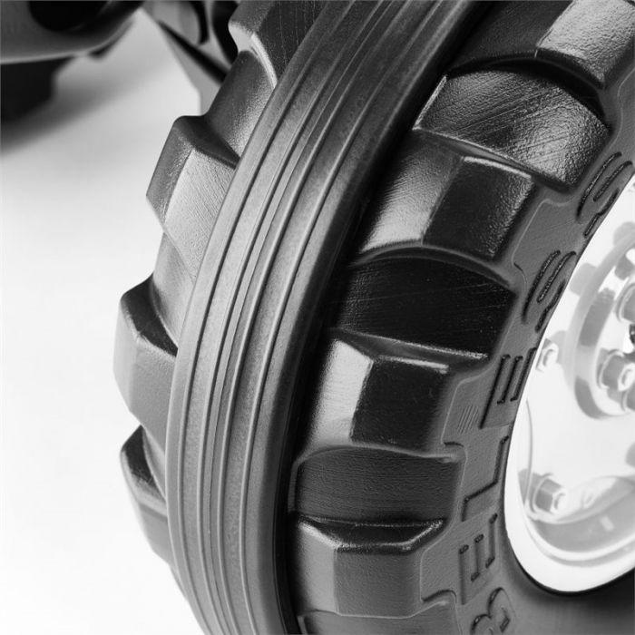 Close-up view of the Valtra - Rubber Rings for Pedal Tractor - V42801830 from AGCO, featuring large, rugged rubber tyres with pronounced treads and part of a shiny metal wheel, perfect for your pedal tractor.